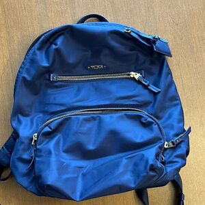 Tumi Navy Backpack with Gold Accents